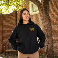 A resident of Latino Living Center posing outside