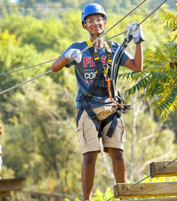 Durjoy Bhadra ’29, on the ropes course at Greek Peak Mountain Resort in Cortland, New York. 