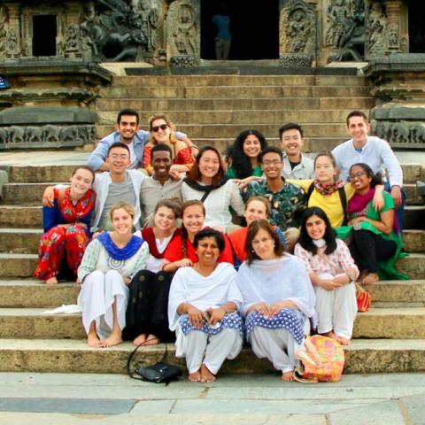 Merrill Scholar Malikul Muhamad, third row, fifth from left, traveled to India in summer 2018 along with Donna Ramil, associate director of the ILR School’s Office of International Programs, seated in front on right, as part of the India SVYM Global Service Learning Program. The group visited Belur Temple to learn about the history and architecture of the temple and its engravings.