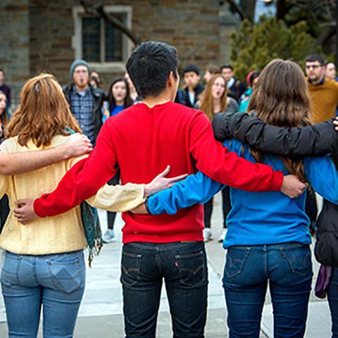 Students lock arms in front of Willard Straight Hall