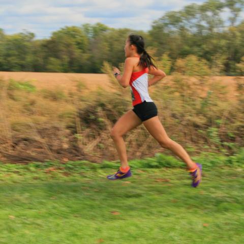 Joanne Hong Wang ’24 races at the Princeton Invitational cross country meet Fall 2021.