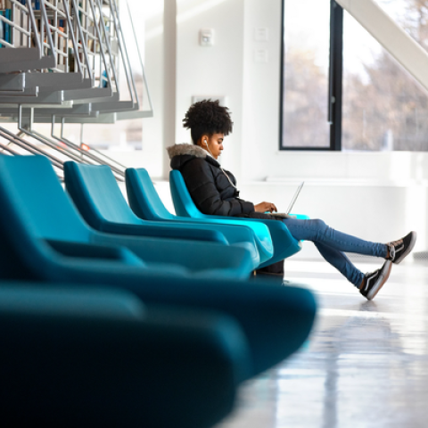 A student works in a campus library