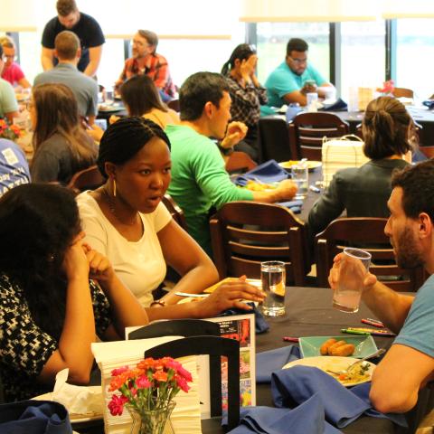 Students around campus dining room tables