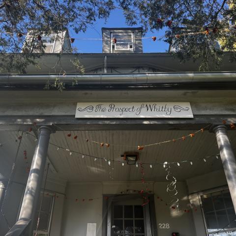 Picture of the front porch of the Prospect of Whitby co-op showing a sign that says "Prospect of Whitby" 