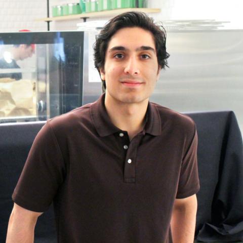 Mikhail Essa in front of the halal station in Morrison Dining
