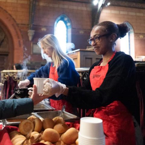 Attendees are served a free meal of soup and bread.