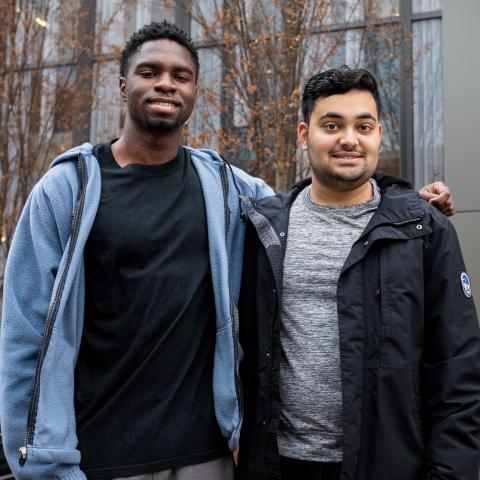 Students pose in front of Toni Morrison Hall
