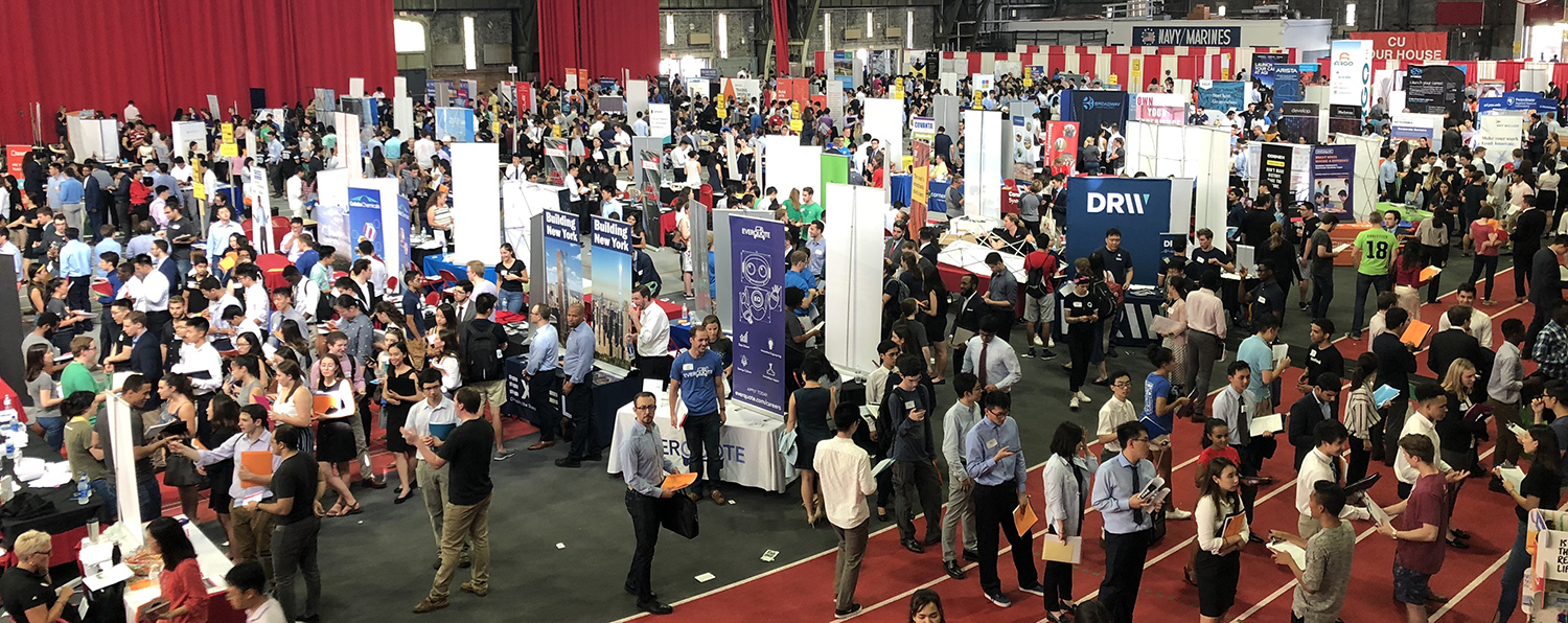 Students and employers inside of Barton Hall talking and meeting at the annual career fair