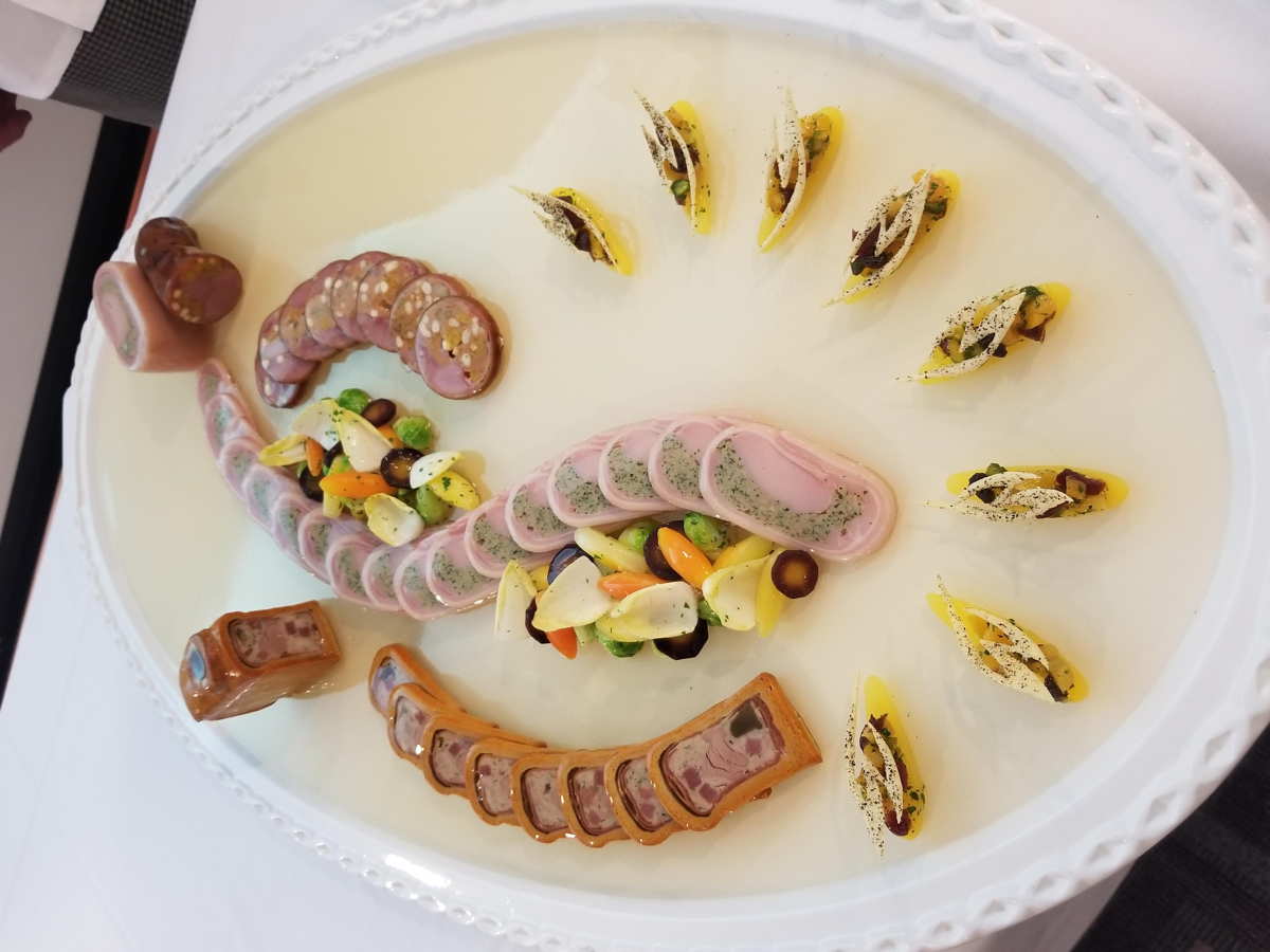 A platter with buffet items arrayed on it