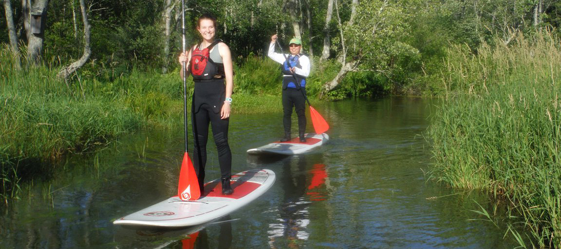 Stand-Up Paddleboarders on the river