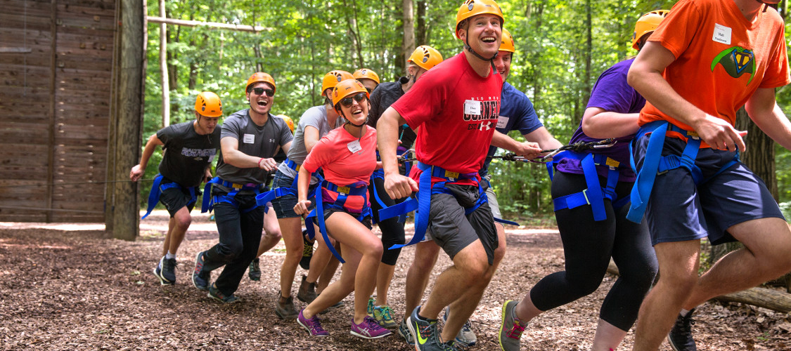 A team of belayers on the challenge course