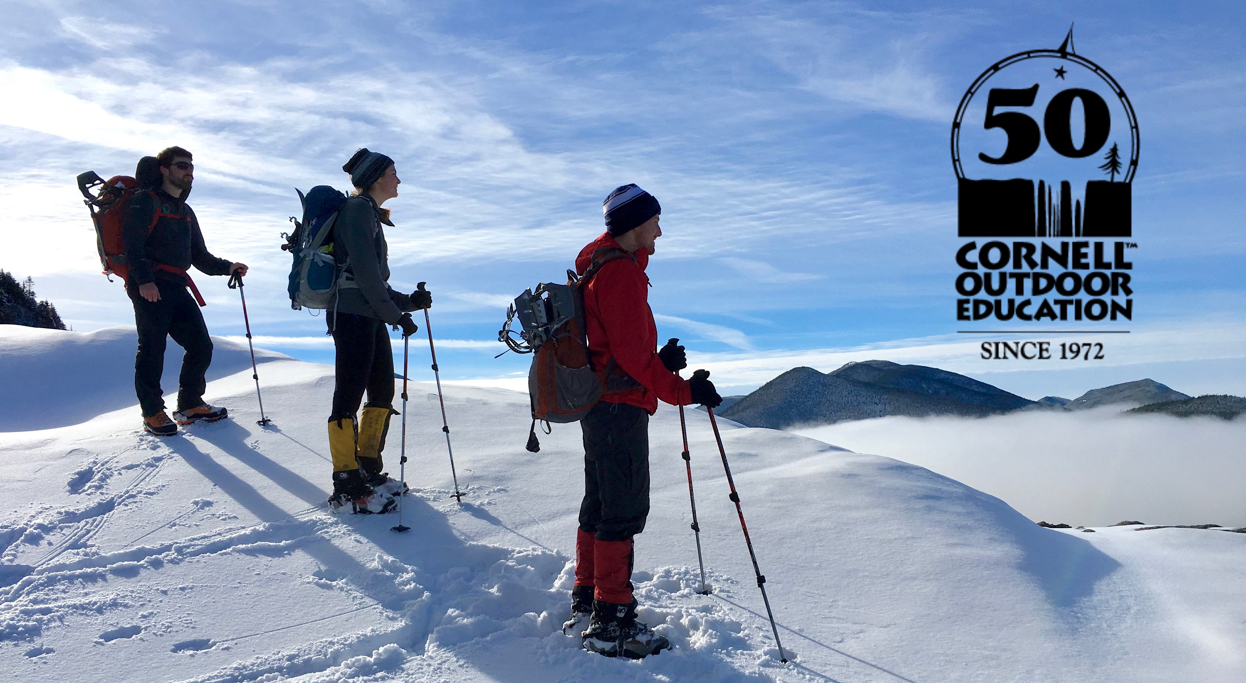 Climbers on Snowy Mountaintop