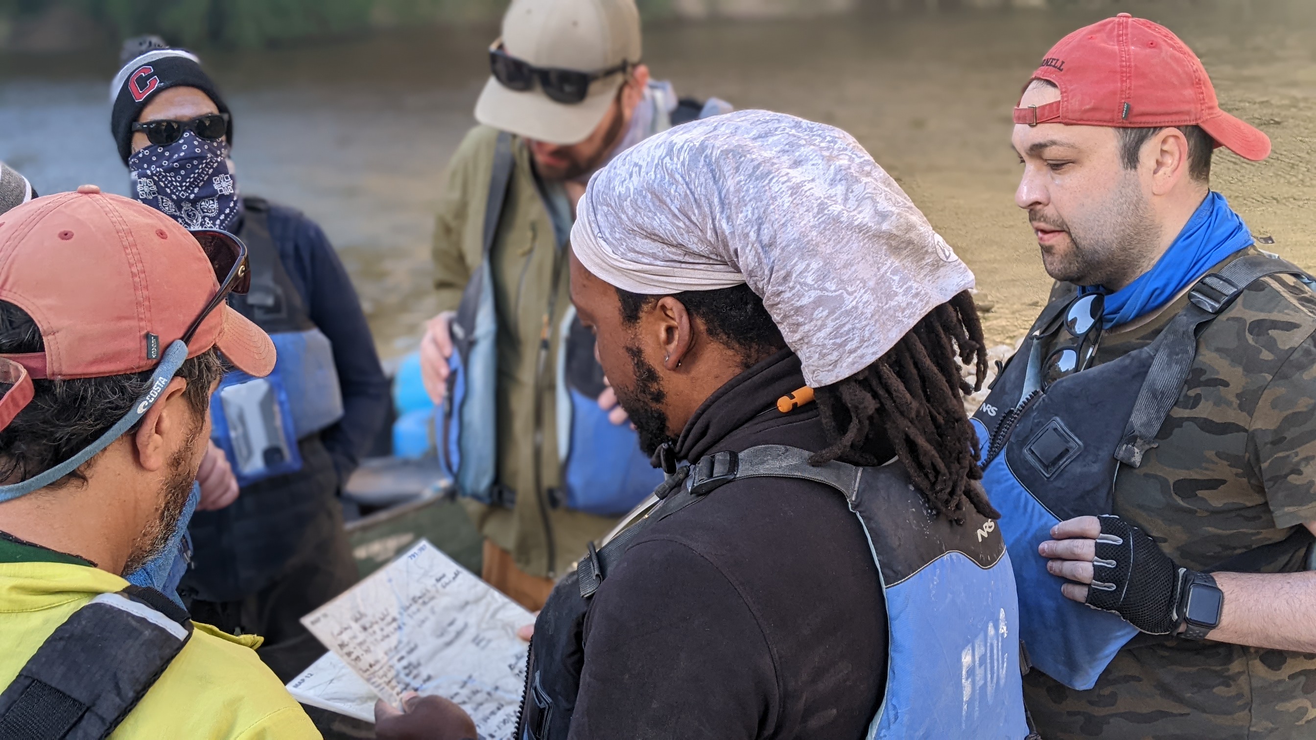 Students on Big Bend Expedition 2022 reviewing the map before setting out on the river