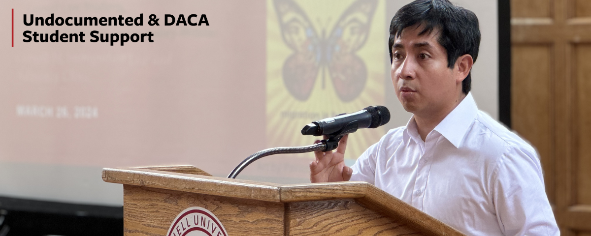 Victor stands at a podium during a workshop for faculty and staff.