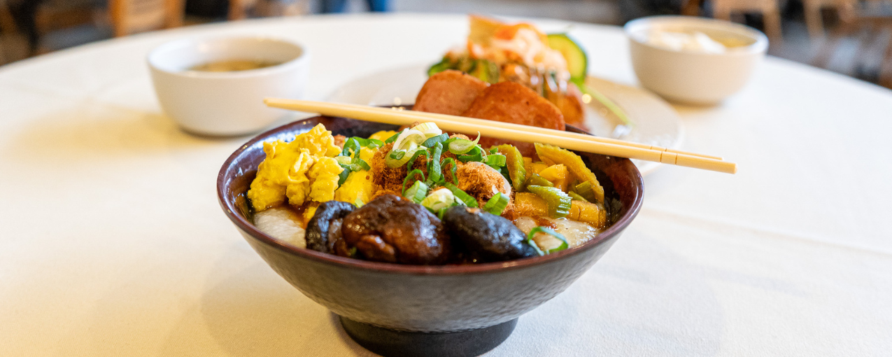 Asian food in bowls on a table.