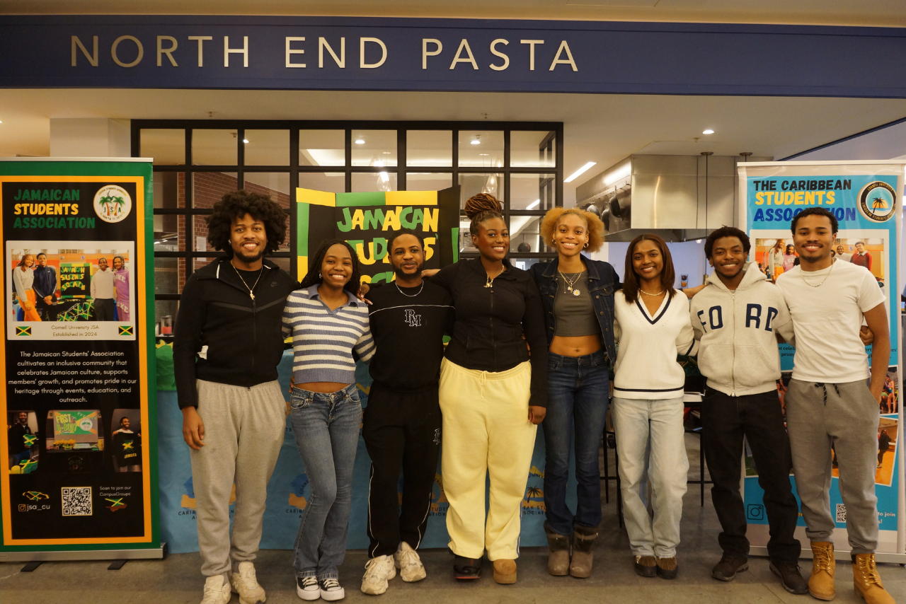 A row of Black students standing in front of the North End Pasta station at Morrison Dining