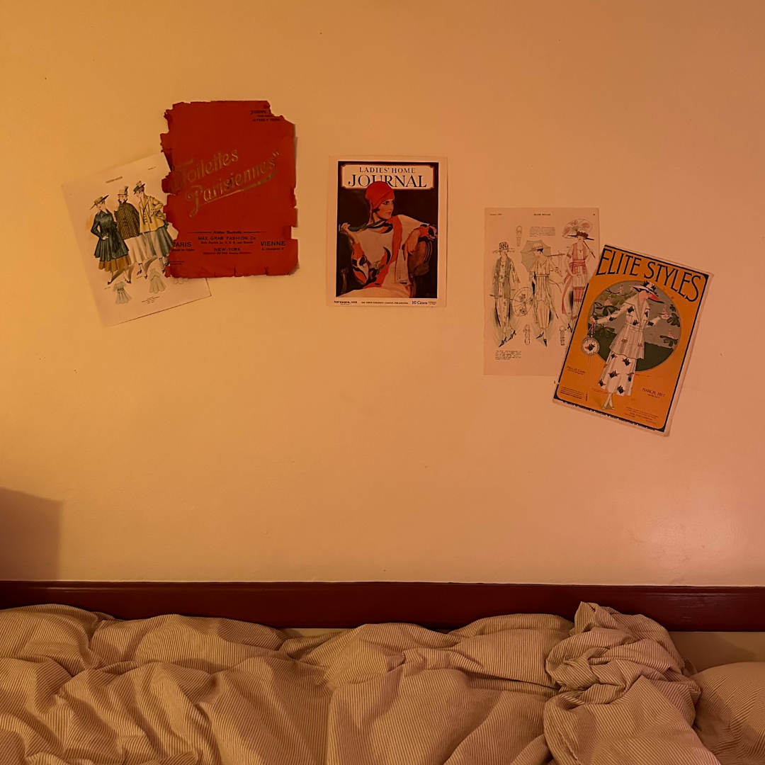 Student room picture posters on wall above bed