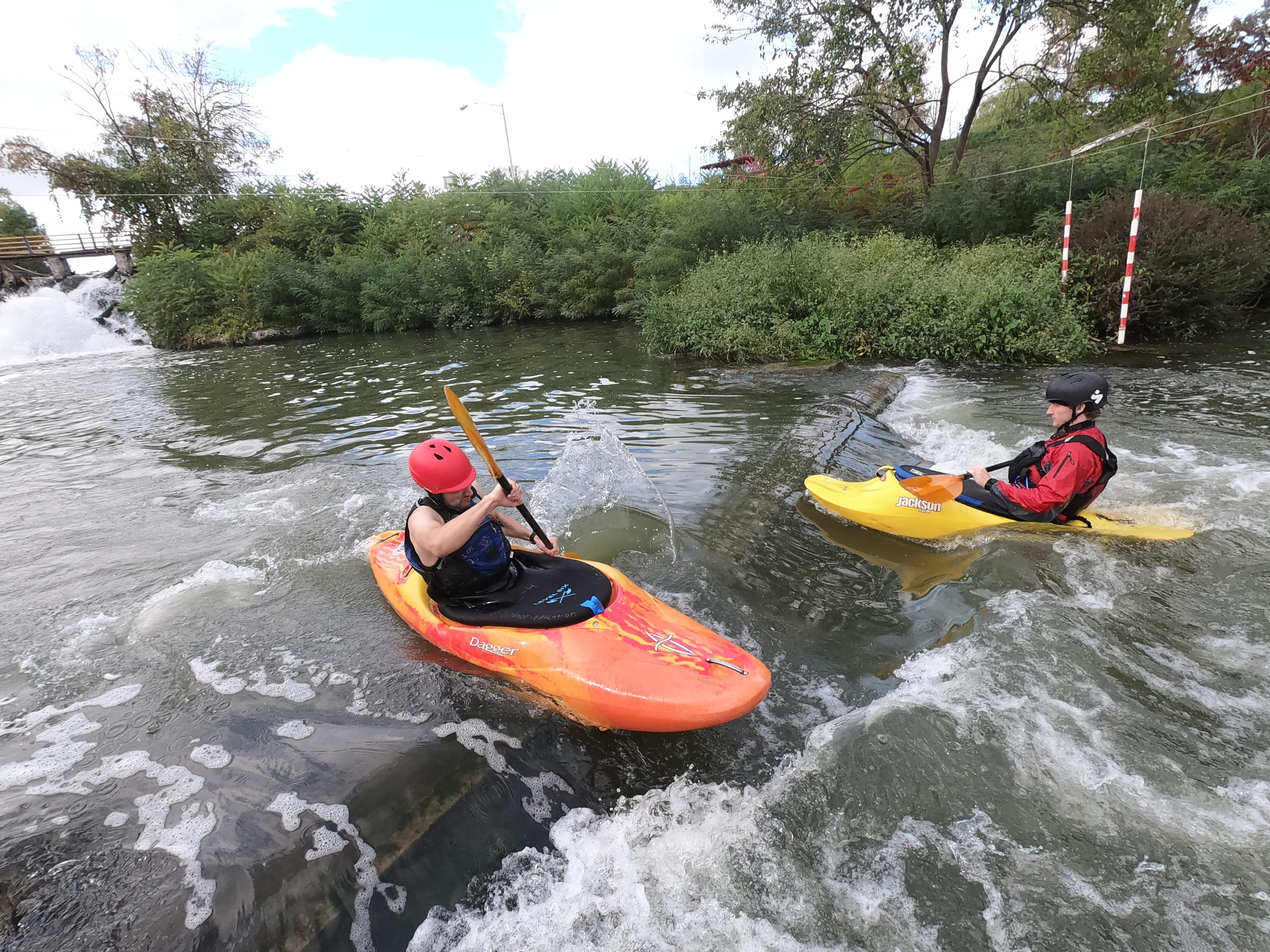 An orange and yellow kayak in the river