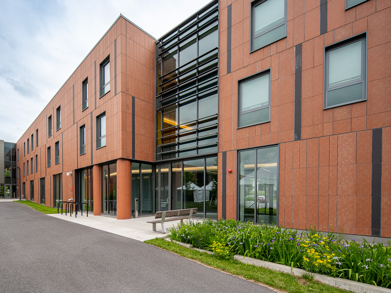 Barbara McClintock Hall with a flower bed out front