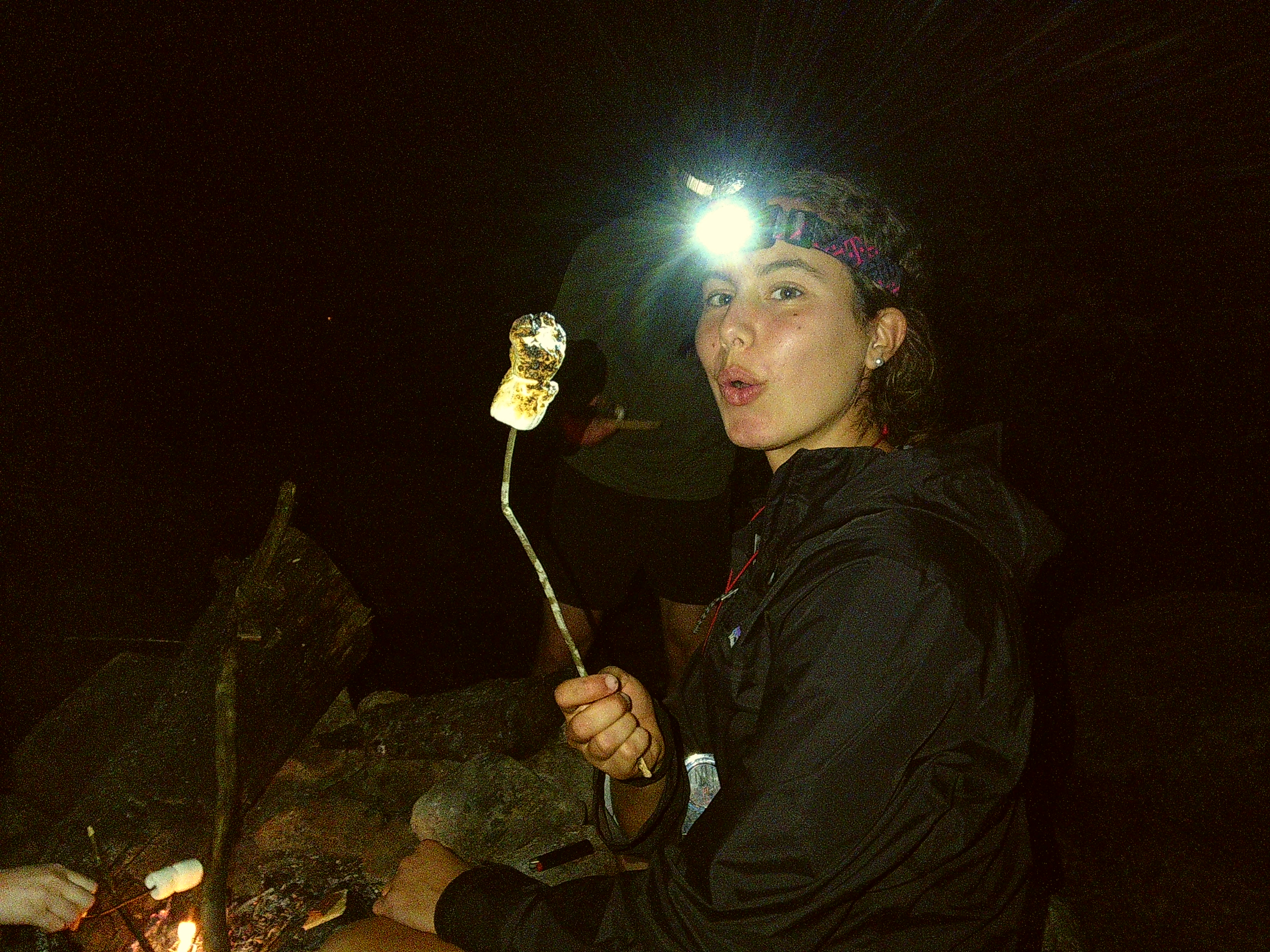 Odyssey trip participant makes smores.