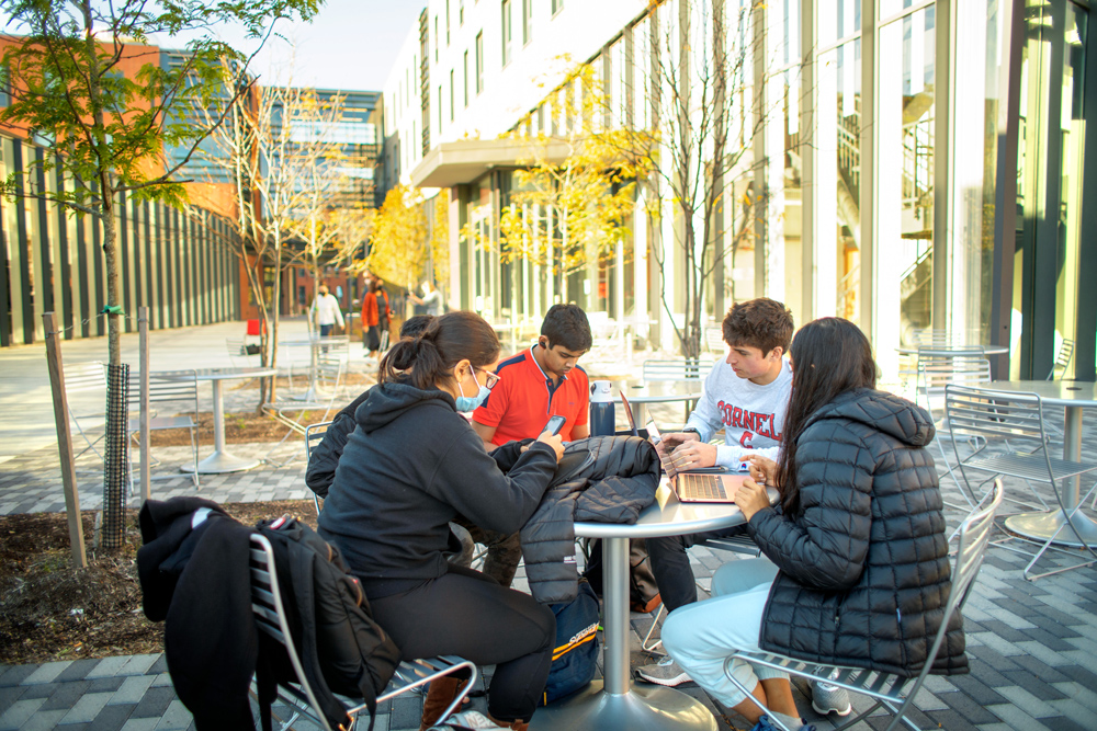 Students studying outside Toni Morrison Hall.
