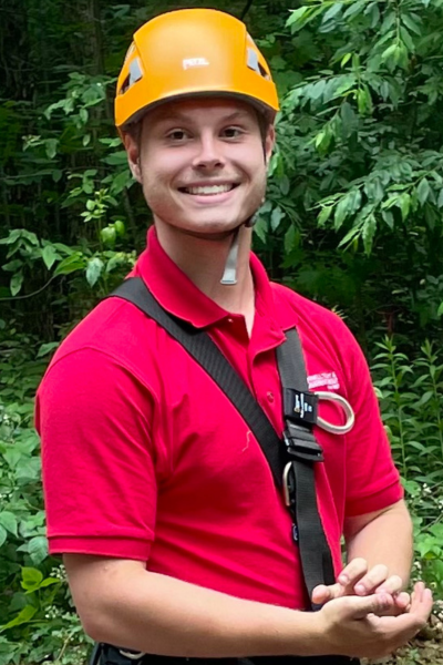 man in red shirt with orange helmet