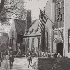 American flag hangs outside of Willard Straight Hall