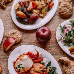 Table filled with apples and apple-inspired food