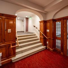 A stairwell surrounded by wood panneling