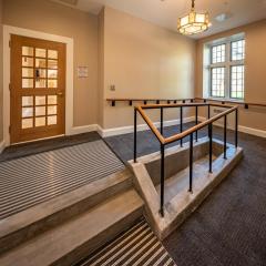 an entrance into Balch Hall that includes stairs and a ramp for accessibility.