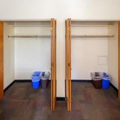 two closets right next to each other and open.