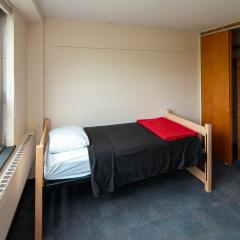 Single room showing the bed, window, and closet.