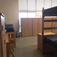 Room with four bunk beds and lots of light