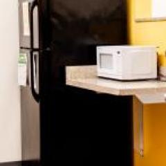 kitchen with a microwave and a fridge